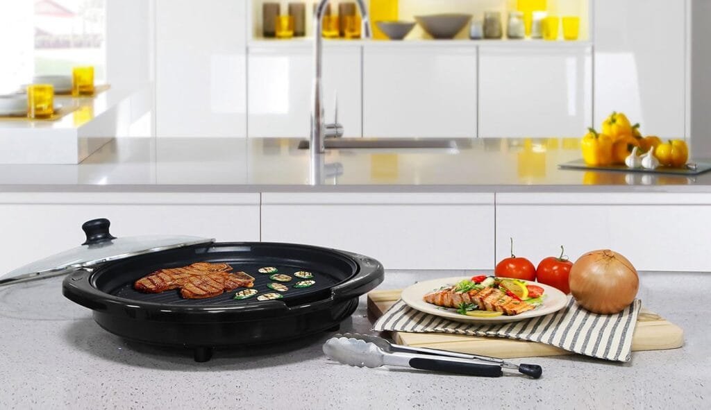 Elite Gourmet EMG1100 Electric Indoor Nonstick Grill, Dishwasher Safe, Cool Touch, Fast Heat Up Ideal Low-Fat Meals, Includes Tempered Glass Lid, 11, Black Elite Gourmet EMG1100 Electric Indoor Nonstick Grill, Dishwasher Safe, Cool Touch, Fast Heat Up Ideal Low-Fat Meals, Includes Tempered Glass Lid, 11, Black