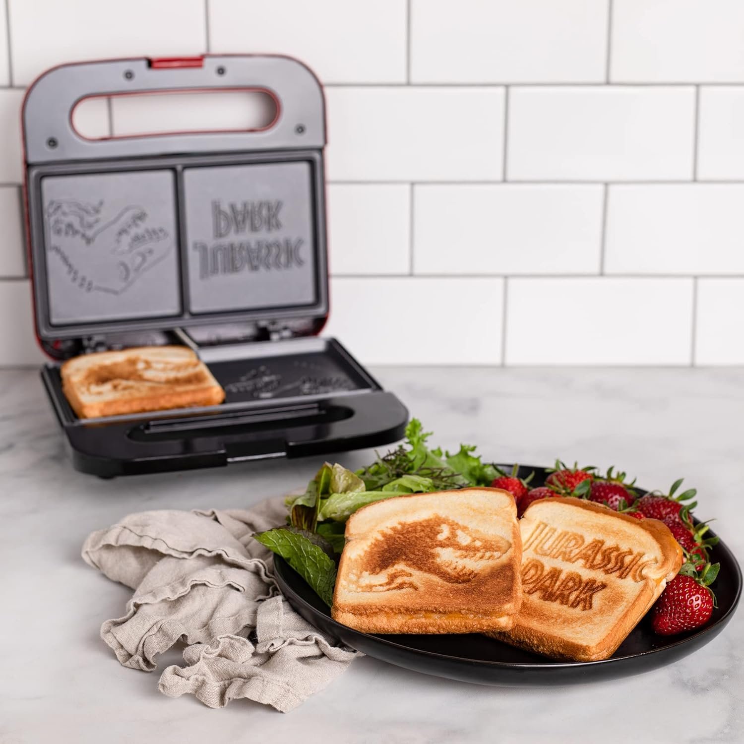 Uncanny Brands Jurassic Park Grilled Cheese Maker- Panini Press and Compact Indoor Grill- Opens 180 Degrees for Burgers, Steaks, Bacon, Non-Stick Surface Uncanny Brands Jurassic Park Grilled Cheese Maker- Panini Press and Compact Indoor Grill- Opens 180 Degrees for Burgers, Steaks, Bacon, Non-Stick Surface