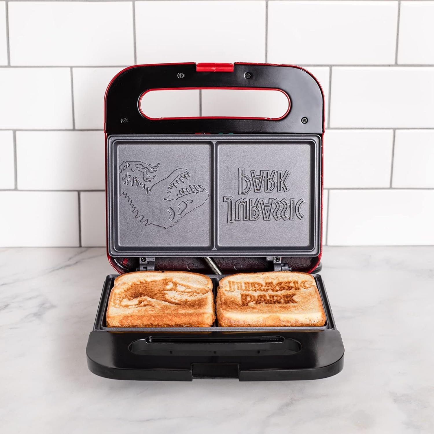 Uncanny Brands Jurassic Park Grilled Cheese Maker- Panini Press and Compact Indoor Grill- Opens 180 Degrees for Burgers, Steaks, Bacon, Non-Stick Surface Uncanny Brands Jurassic Park Grilled Cheese Maker- Panini Press and Compact Indoor Grill- Opens 180 Degrees for Burgers, Steaks, Bacon, Non-Stick Surface